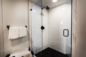 A bathroom with a walkin shower.