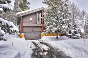 The exterior of Aspen Hollow 6 covered with snow.