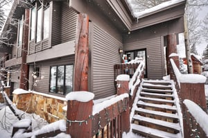 The exterior of Aspen Hollow 6 covered with snow.
