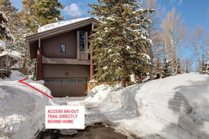 The exterior of Aspen Hollow 6 with a skiout trail to Deer Valley Resort.