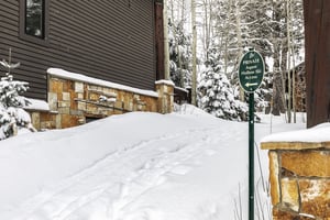 The exterior of Aspen Hollow 6 with a skiout trail to Deer Valley Resort.