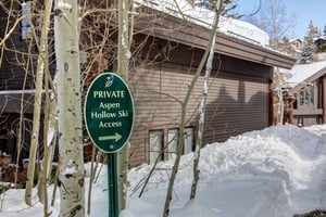 The exterior of Aspen Hollow 6 with a skiout trail to Deer Valley Resort.