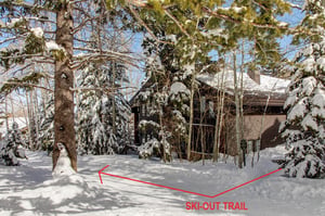 The exterior of Aspen Hollow 6 with a skiout trail to Deer Valley Resort.