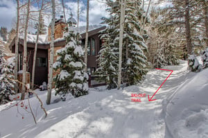 The exterior of Aspen Hollow 6 with a skiout trail to Deer Valley Resort.