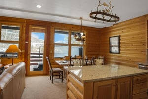 The open concept kitchen and dining area with private hot tub right outside the door.