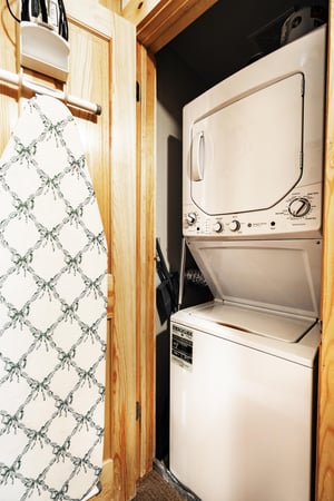Private stacked washer and dryer.