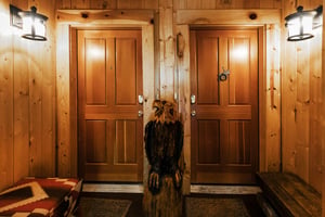 The entrance to Comstock 203 with wooden eagle sculpture