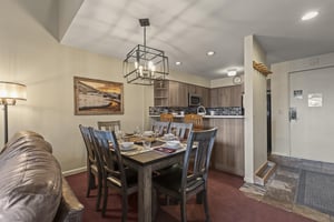 Snow Flower 127 has an open concept kitchen and dining area with seating for 6 at the dining table.
