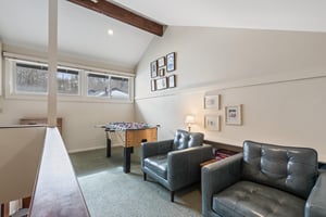 The loft offers a foosball table for kids and adults alike and a sitting area.