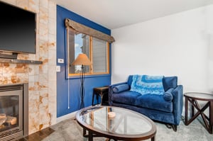 An additional blue sofa in the living area.