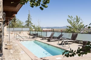 Pool and hot tub area at the Lowell Condominiums