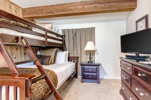 The loft has a bunk bed with a queen bed on the bottom and twin bed on the top.