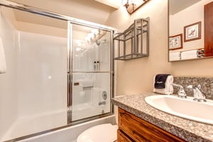 The bathroom offers a bathtub and shower combination.