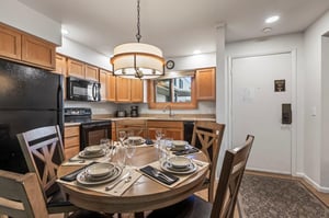 Snow Flower 79 offers an open concept kitchen with a dining area with seating for five guests.