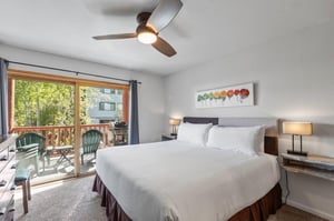The main suite offers a kingsize bed and sliding glass doors that lead to a private patio.