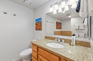 The en suite bathroom with a single sink vanity.