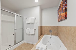 The en suite bathroom with deep soaker bathtub and walkin shower.