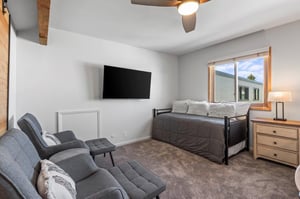 The loft with a twin size day bed and sitting area.