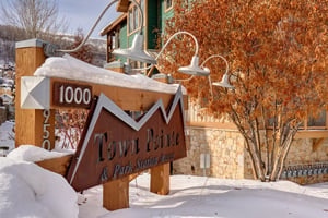 Town Pointe Condominiums sign with snow on the ground.