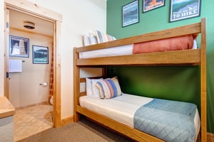 The loft has twin bunk beds and attached bathroom.