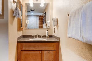 The upstairs bathroom has a single sink vanity.