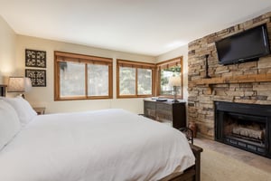 Main bedroom with wood burning fireplace