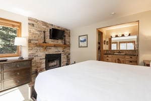 Main bedroom features a kingsized bed