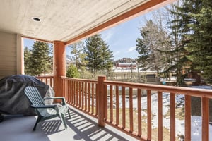 Private patio with views of the First Time Chairlift with a gas grill
