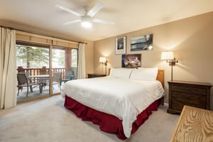 Main bedroom features a kingsized bed
