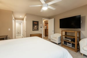 Main bedroom features a wall mounted flat screen TV