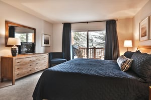Main bedroom with flat screen TV and access to the private patio