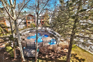 Private patio has views of the clover shaped pool