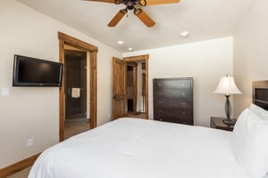 Queensized bed in the third bedroom