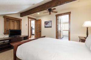 Comfortable queensized bed in the fourth bedroom