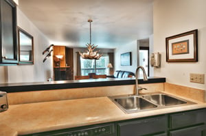 The kitchen opens to the dining area and living room
