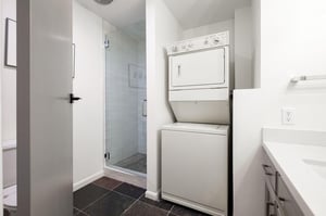 Stacked washerdryer in the guest bathroom