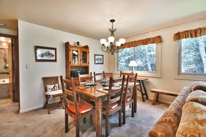 Seating for 6 at the solid wood dining room table in high back wooden chairs