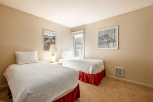 The guest bedroom features two comfortable twinsized beds