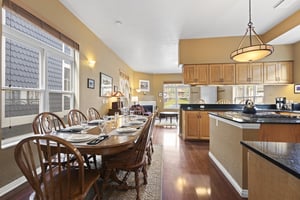 The Ushape kitchen has a center island and is open to the dining table.