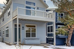 The exterior of Old Town Retreat is light blue with white trim.