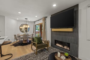 The living room offers a gas burning fireplace and large flat screen TV.