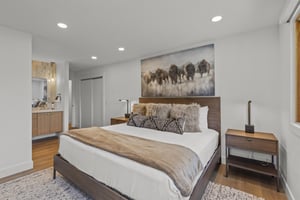 The main suite has a kingsize bed with stylish and modern furnishings.
