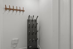 The entryway offers a comfortable bench and place to hang coats.