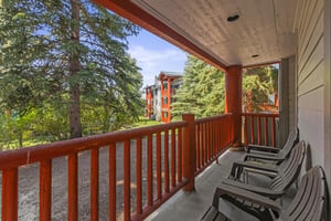 Snow Flower 44 has a private patio and overlooks majestic evergreen trees.