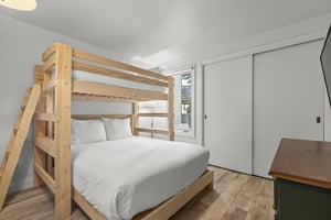The second bedroom offers a twin over a queen size bunk bed.