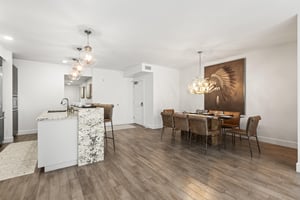 The open concept kitchen and dining area are spacious and bright.