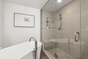 The en suite bathroom a walkin shower and a deep soaker tub.