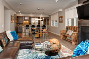 Sophisticated open concept living, dining, and kitchen area.