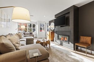 The Rio Grande 203 living room has a large sectional sofa, flat screen TV, and gas burning fireplace.