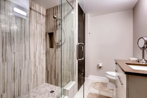 The en suite bathroom has a walkin shower with glass surround.